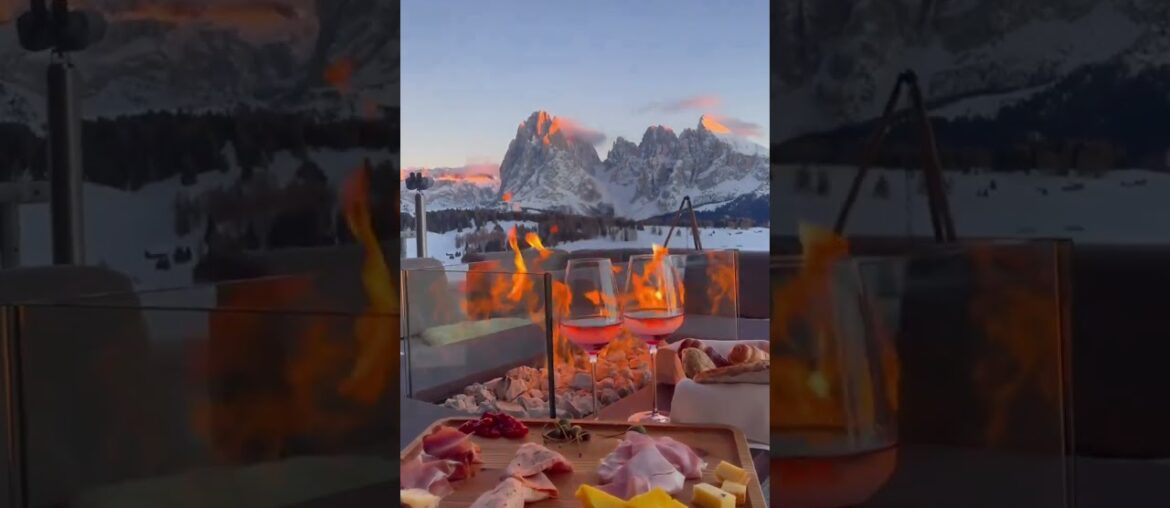 Toast to the Alps: Enjoying a Glass of Wine with a Breathtaking View and a Warm Fire. Want to Join?