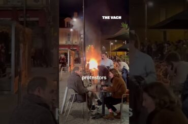 French diners drink wine in fire and protestors eat fancy #shorts