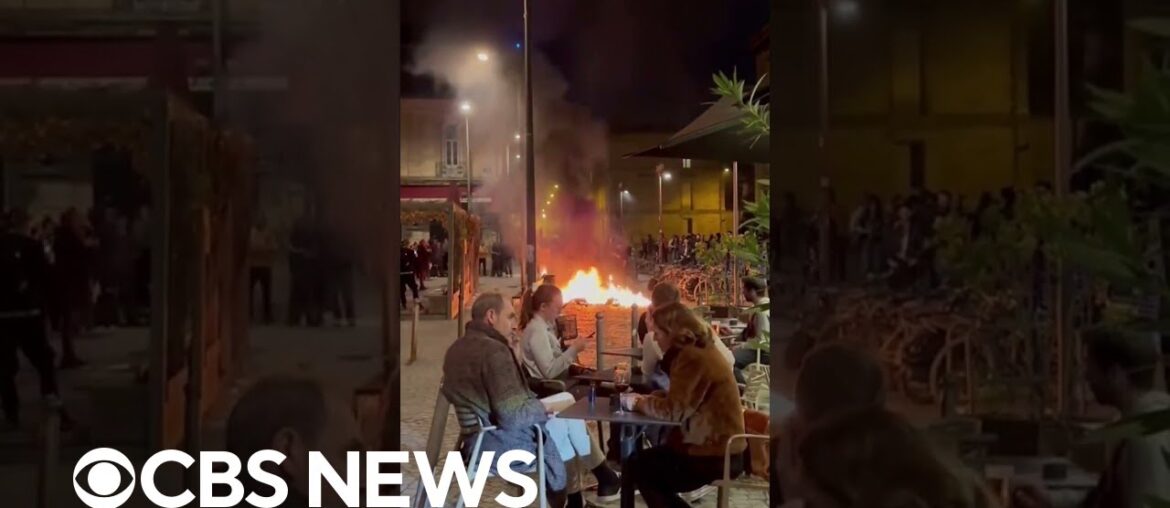 French diners have wine near fires lit by demonstrators protesting divisive pension reforms #shorts