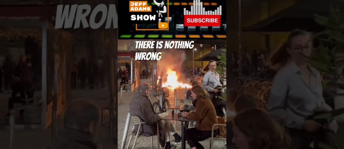 #shorts French diners sip wine as fires break out in protest against Macron