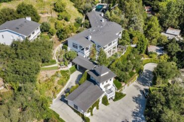 A $25 Million Beverly Hills compound with over 16,000SF of living spaces and a long private driveway