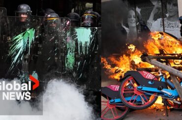 Police in Paris pelted with paint as pension reform protests flare