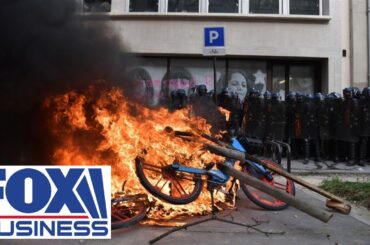 BlackRock's Paris offices swarmed by French protesters with red flares, smoke bombs