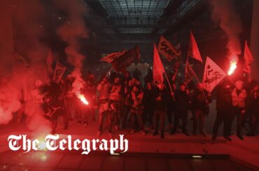 French protesters with flares storm BlackRock offices in Paris