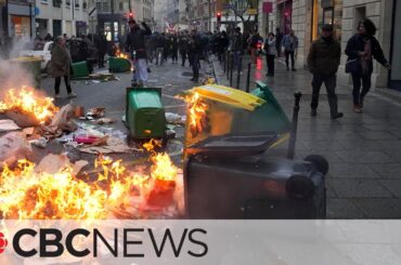 Violent protests in France as president signs bill to reform retirement age
