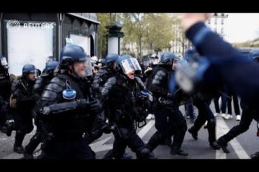 Riot police face off with protesters in Paris