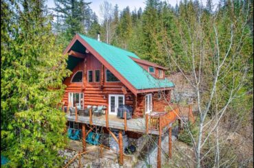 GRAND LOG HOME MASTERPIECE - FOR SALE NEAR MABEL LAKE - YOUR DREAM HOME AWAITS!
