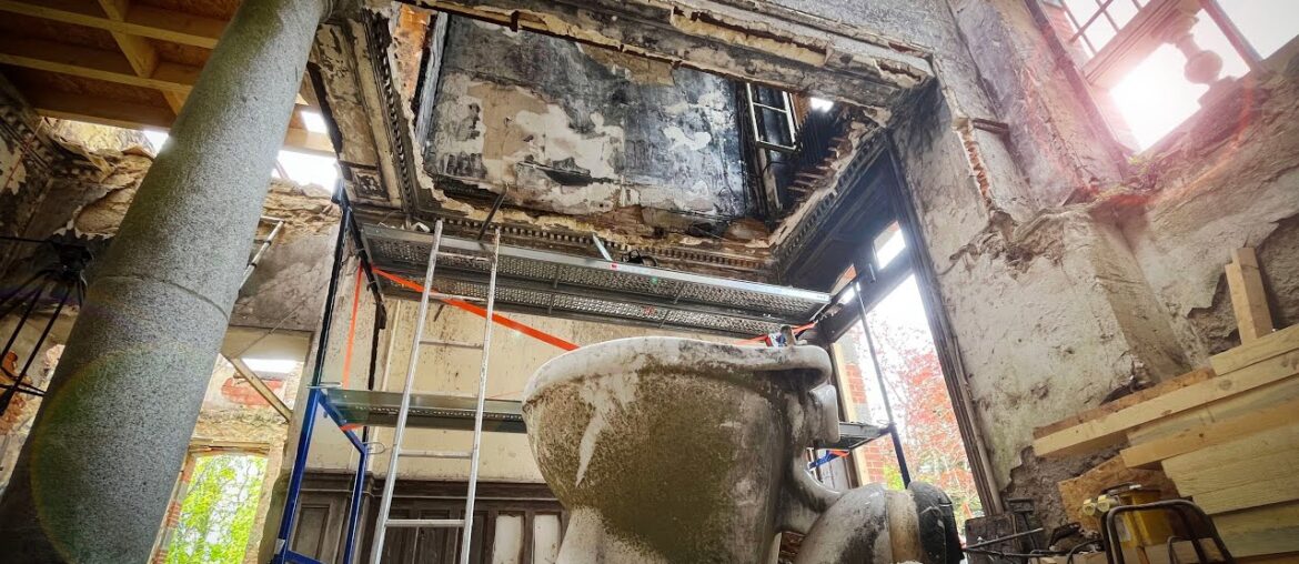 Hanging by a thread; Risky removal of burnt out bathroom and hanging toilet.