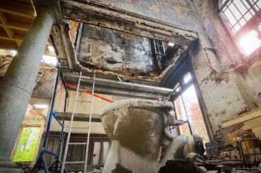 Hanging by a thread; Risky removal of burnt out bathroom and hanging toilet.