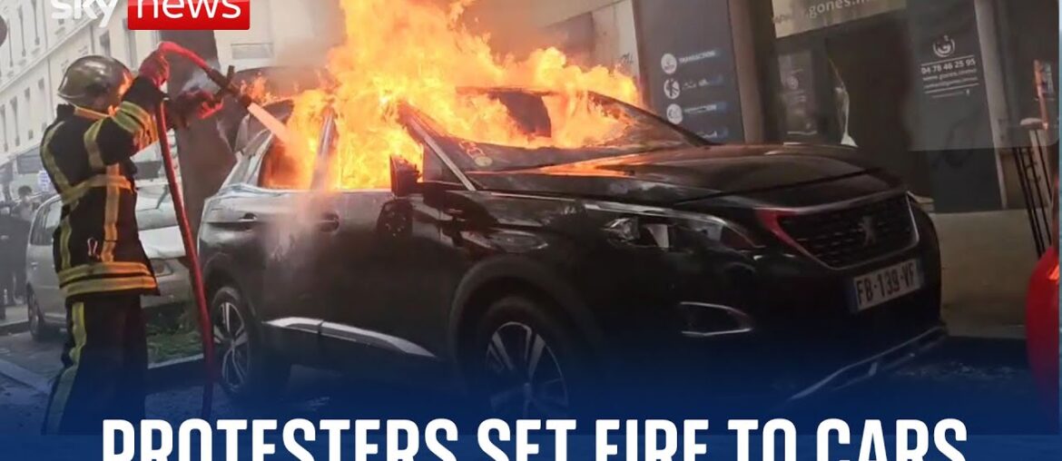 France: Police fire tear gas as protesters set fire to cars and buildings