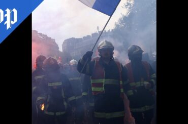 French march for workers' rights in May Day protests