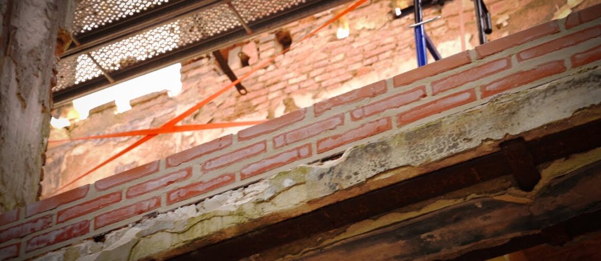 The first new brick work going back into the chateau .