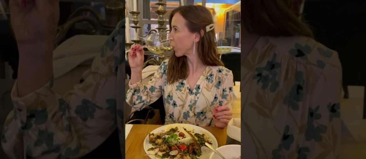 Elegant restaurant drinking white French wine flower dress pearl femme fatale fashionista