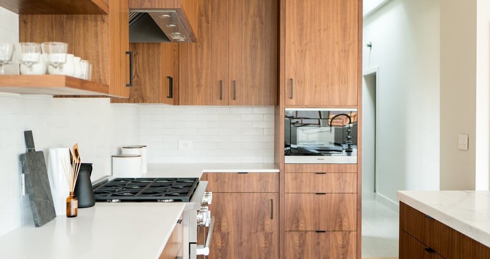 walnut cabinets blending into open shelving