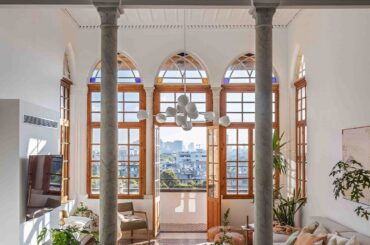Living room opening to the balcony in a renovated 19th-century Ottoman-era house, Jaffa, Tel Aviv, Israel [1140x1600]
