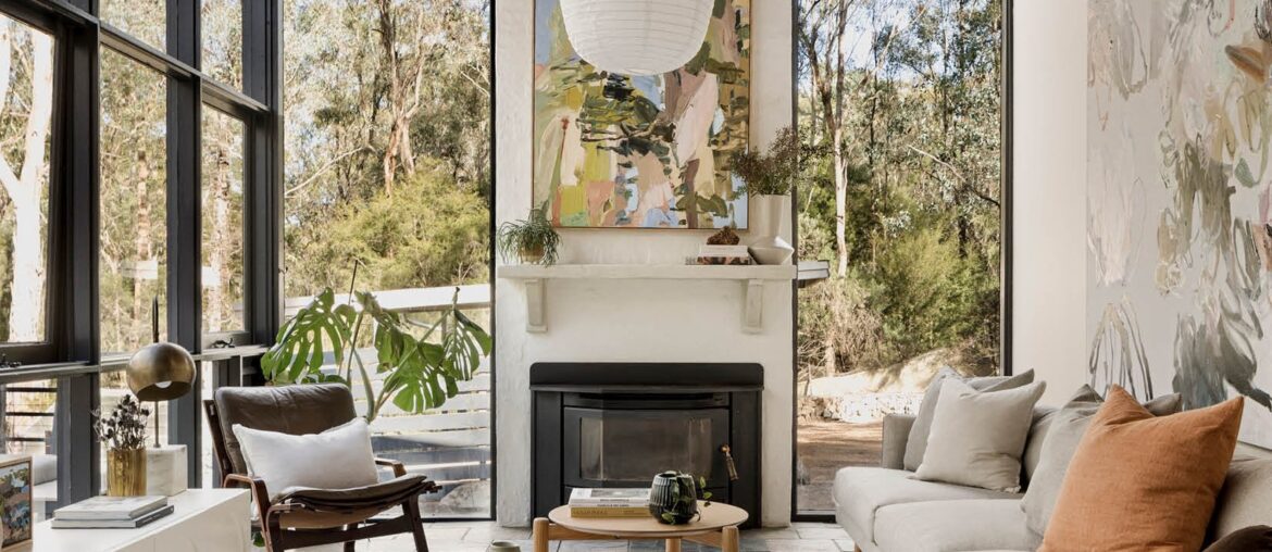 Living room with floor-to-ceiling windows in a renovated residence originally designed by prominent Australian architect Robin Boyd in 1956, Warrandyte, Melbourne, Victoria, Australia [1653x2133]