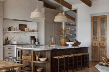 Kitchen under a vaulted ceiling with exposed beams in a lakeside residence near Lake Simcoe, southern Ontario, Canada reposted fromr/RoomPorn u/ManiaforBeatles