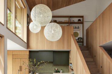 Double-height kitchen and dining space in a beach house, Pebble Beach, Monterey County, California [2500x3333]