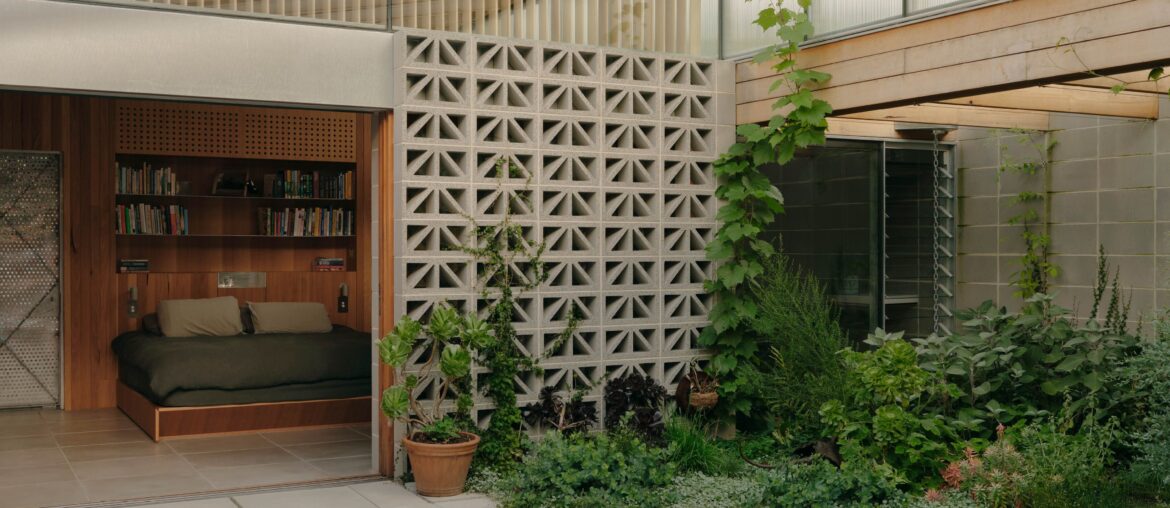 Bedroom opening up to the courtyard garden in a renovated residence, Fitzroy, Melbourne, Victoria, Australia [4000x2249]