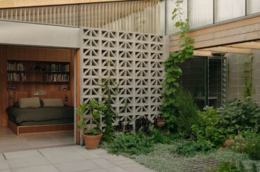 Bedroom opening up to the courtyard garden in a renovated residence, Fitzroy, Melbourne, Victoria, Australia [4000x2249]