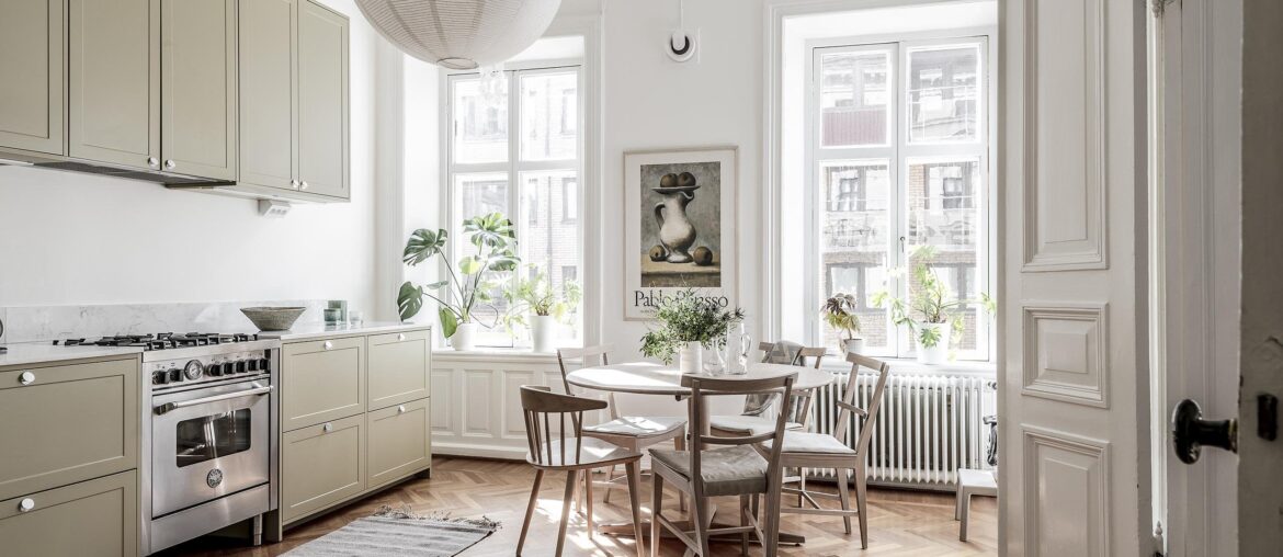 Kitchen and dining space with a herringbone floor in an 1886 apartment, Gothenburg, Västra Götaland County, Sweden [2560x1707]