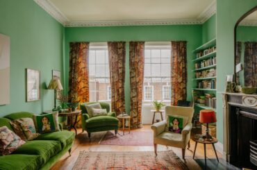 Drawing room with built-in bookcases and an original fireplace in a 1760s townhouse, Carlisle, Cumbria, England [2400x1600]