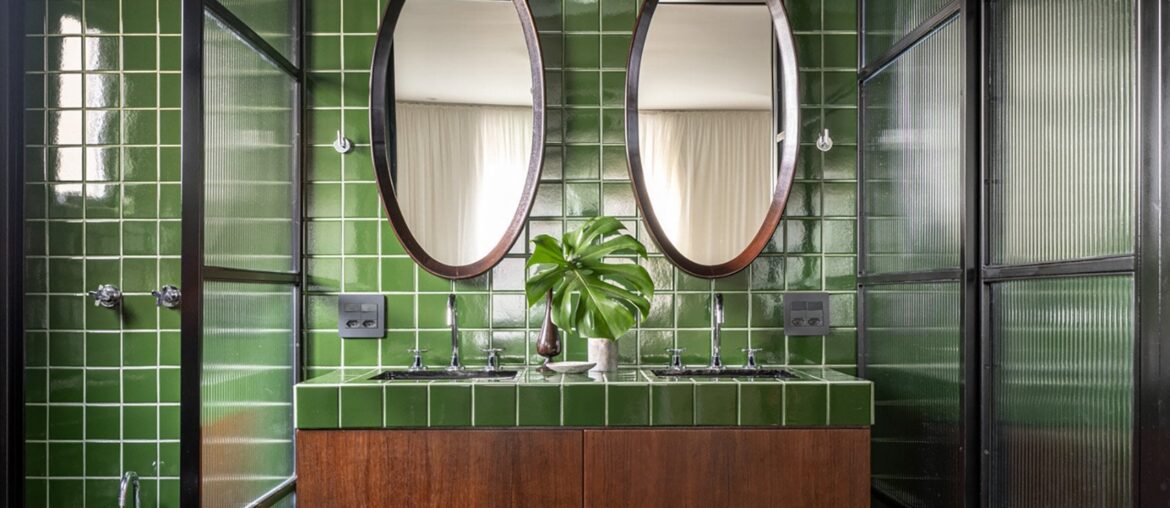 Ensuite bathroom clad with green tiles in a renovated São Paulo apartment, Brazil [1704x1704]