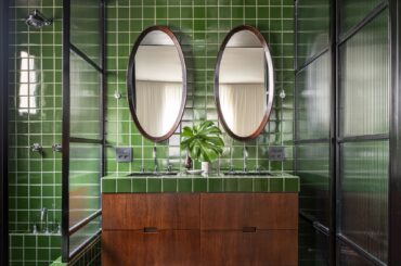 Ensuite bathroom clad with green tiles in a renovated São Paulo apartment, Brazil [1704x1704]