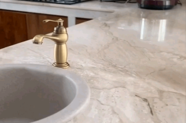 Completed a custom built teak wood kitchen cabinet with marble countertop