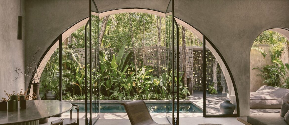 Living room / bar with semi ciricle glass opening to dunk pool in Villa Petricor. [1024 x 683] Tulum, Mexico