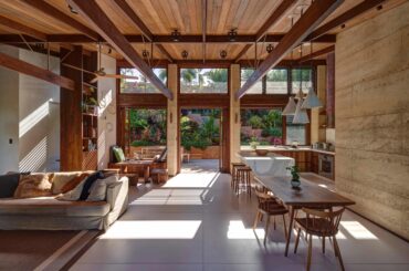 Open plan living with exposed beams looking onto lush garden. [7676x 5246] Byron Bay New South Wales, Australia