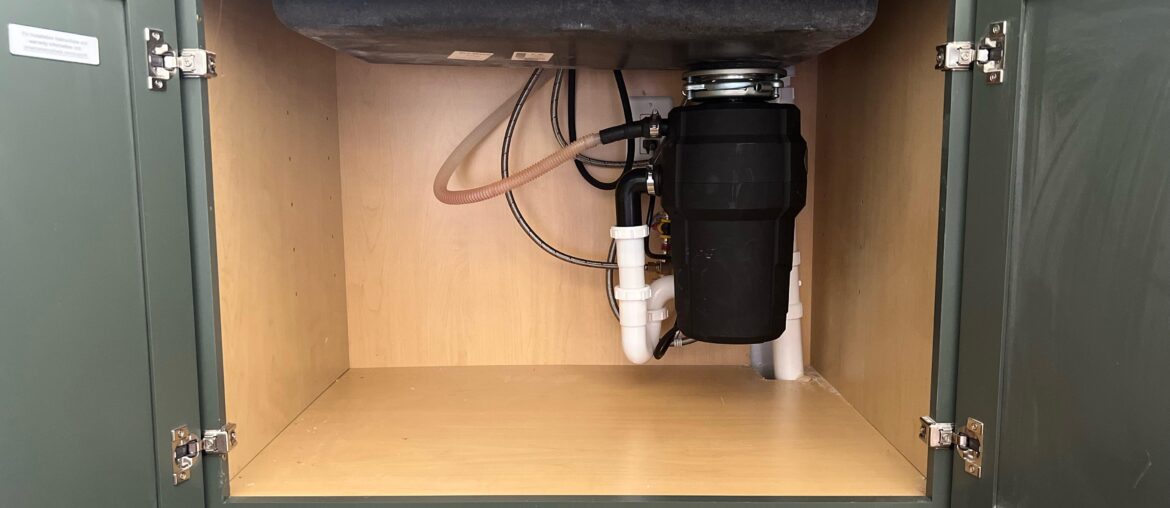 Designed my own kitchen and manager to shove all the under cabinet plumbing in the corner to maximize space. Love when a plan comes together perfectly