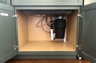 Designed my own kitchen and manager to shove all the under cabinet plumbing in the corner to maximize space. Love when a plan comes together perfectly