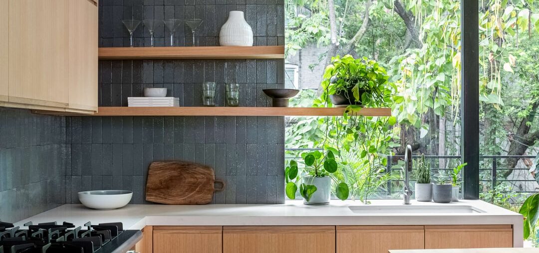 light oak veneer, caeserstone countertops, eye-catching vertically arranged tiled backsplash