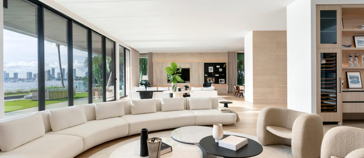 Living Room with Floor to Ceiling Glass Sliding Doors in Miami Beach Home [4889×3278]