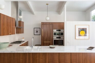 walnut cabinetry, copper handles, white marble countertops