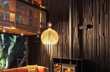 Dark and cozy living room by Herbst Architects [666 x 1000] Auckland New Zealand