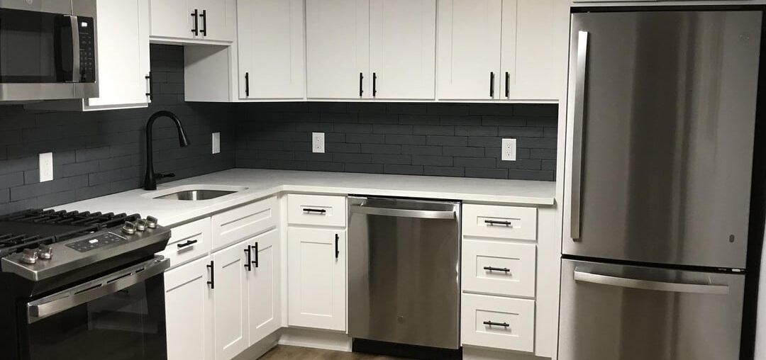Kitchen before & after. Had to keep the same footprint. Part of a whole house renovation that was long delayed.