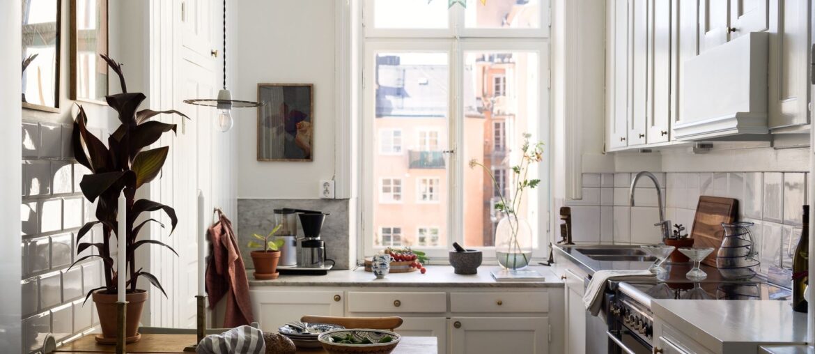 Apartment kitchen with a view in a 1905 building, Södermalm, central Stockholm, Sweden [2000x1499]