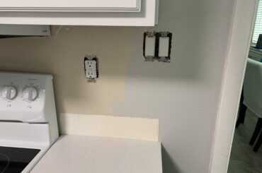 How would you handle this backsplash install? The switches are right where I would want the tile to end.