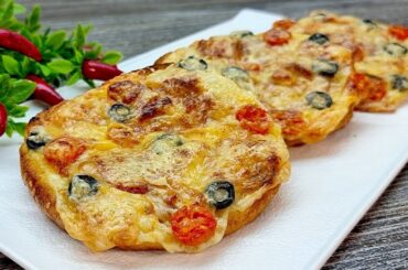 "Baguette Delite: Gourmet Sandwich with Ham, Two Kinds of Cheese, and Mediterranean Toppings"