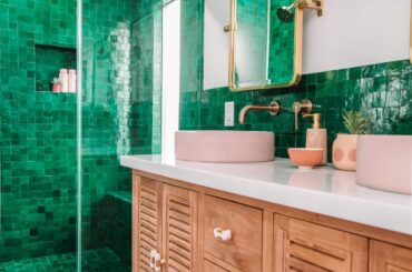 Green zellige tile shower and backsplash in a renovated bathroom of a Los Angeles home [1200x1600]