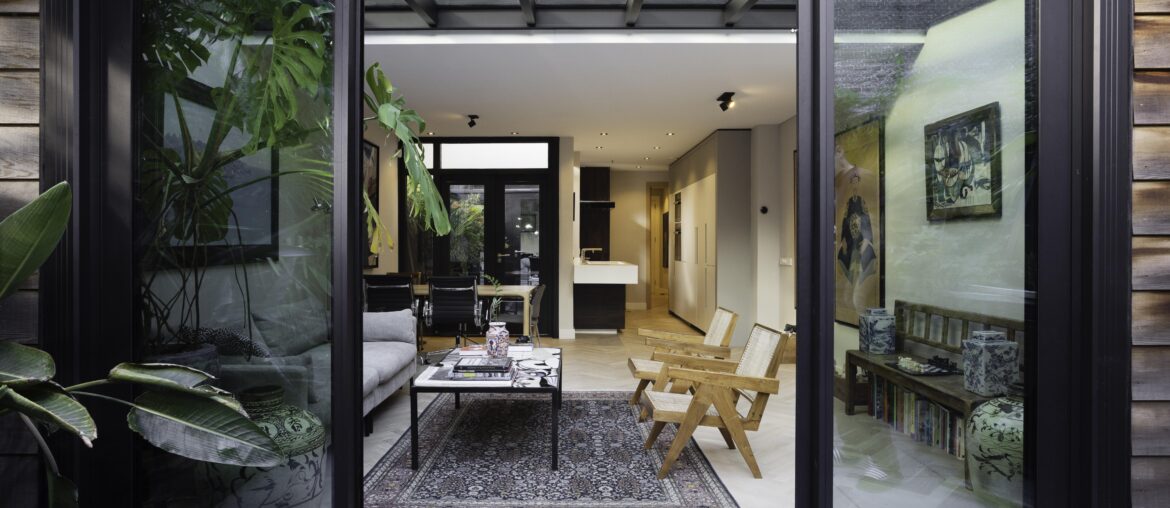 Newly renovated living room and kitchen with white oak parquet floors and mid-century modern furniture. By Studio Botanica [7503 × 5002]