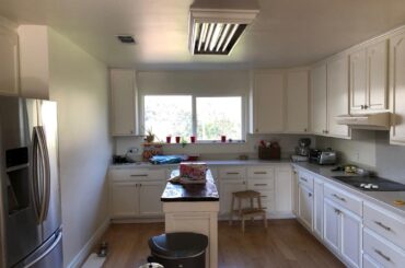 We took a 1950's ranch house and blended hyper minimal design with steampunk materials. The concept: Stark Punk