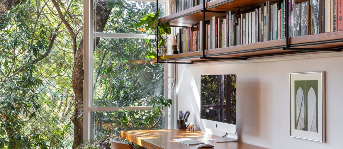 Home office space in the expanded living room of a renovated apartment, Asa Sul, Brasília, Brazil [1365x2048]