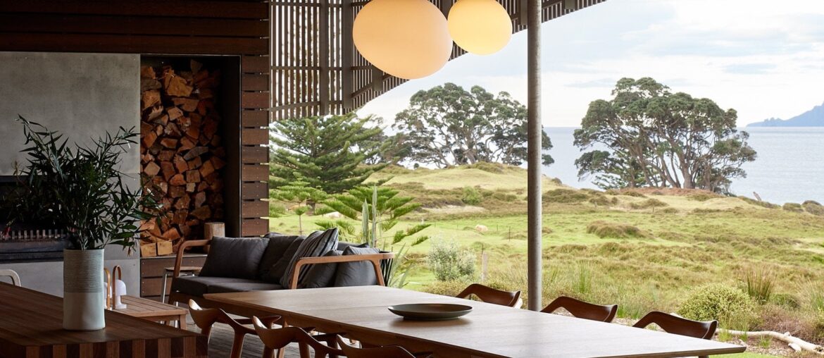 Timber lined living space of a modern residence opening up to the east coast of New Zealand [1667x2500]