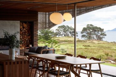 Timber lined living space of a modern residence opening up to the east coast of New Zealand [1667x2500]