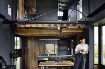 Tiny home open plan kitchen and dining with mezzanine office and bedroom [750 x 1000] Australia