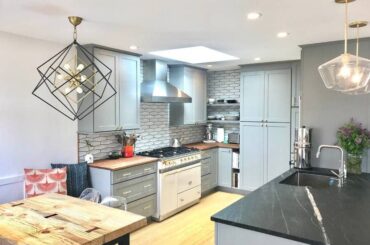 Massive kitchen designed by CliqStudios.com using gray blue/green cabinets and TWO islands!