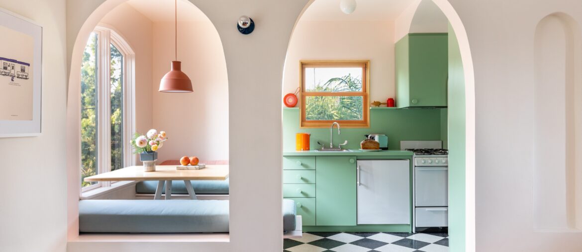 Arched entry to a mint green kitchen with banquette seating, Echo Park, Los Angeles [5027x3352]